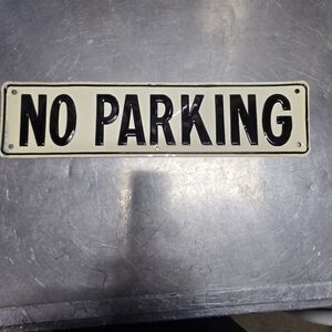 No Parking Metal Sign. Approx. 3X12 Inches. Very Good Condition.